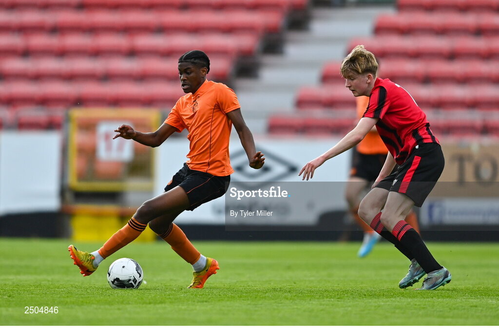 6 May 2023; Thalaga Segoapa of St Kevin's FC in action against Adam Byrne of Cherry Orchard FC during the FAI Under 17 Cup Final 2022/23 match between Cherry Orchard FC and St Kevin’s Boys FC at Richmond Park in Dublin. Photo by Tyler Miller/Sportsfile
