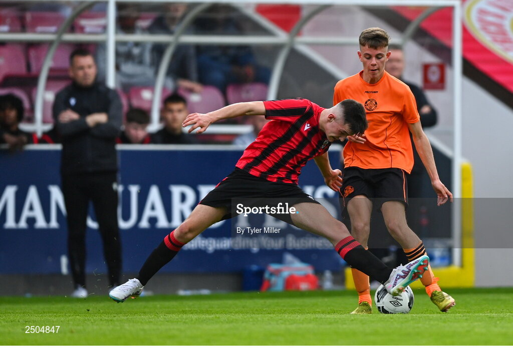 6 May 2023; Jamie Cummins of St Kevin's FC is tackled by Ger Crawley of Cherry Orchard FC during the FAI Under 17 Cup Final 2022/23 match between Cherry Orchard FC and St Kevin’s Boys FC at Richmond Park in Dublin. Photo by Tyler Miller/Sportsfile