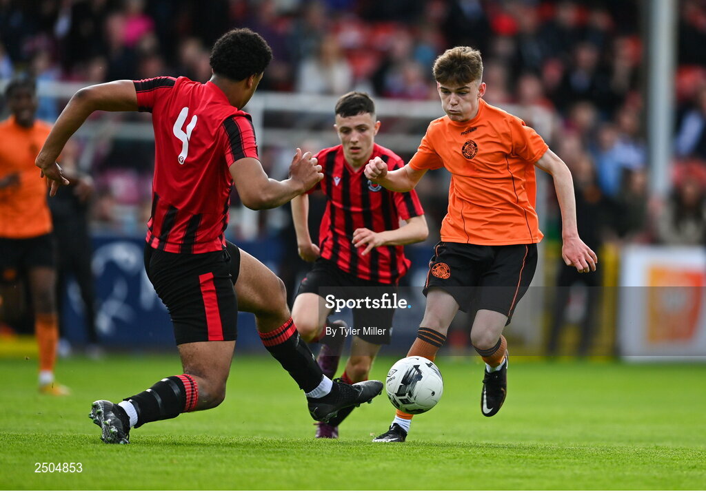 6 May 2023; Sam Dunne of St Kevin's FC is tackled by Josh Okagbue of Cherry Orchard FC during the FAI Under 17 Cup Final 2022/23 match between Cherry Orchard FC and St Kevin’s Boys FC at Richmond Park in Dublin. Photo by Tyler Miller/Sportsfile