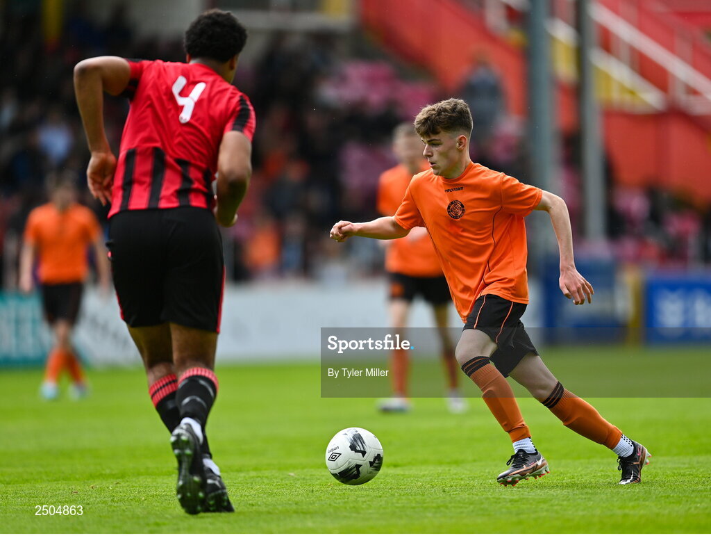 6 May 2023; Sam Dunne of St Kevin's FC in action against Josh Okagbue of Cherry Orchard FC during the FAI Under 17 Cup Final 2022/23 match between Cherry Orchard FC and St Kevin’s Boys FC at Richmond Park in Dublin. Photo by Tyler Miller/Sportsfile