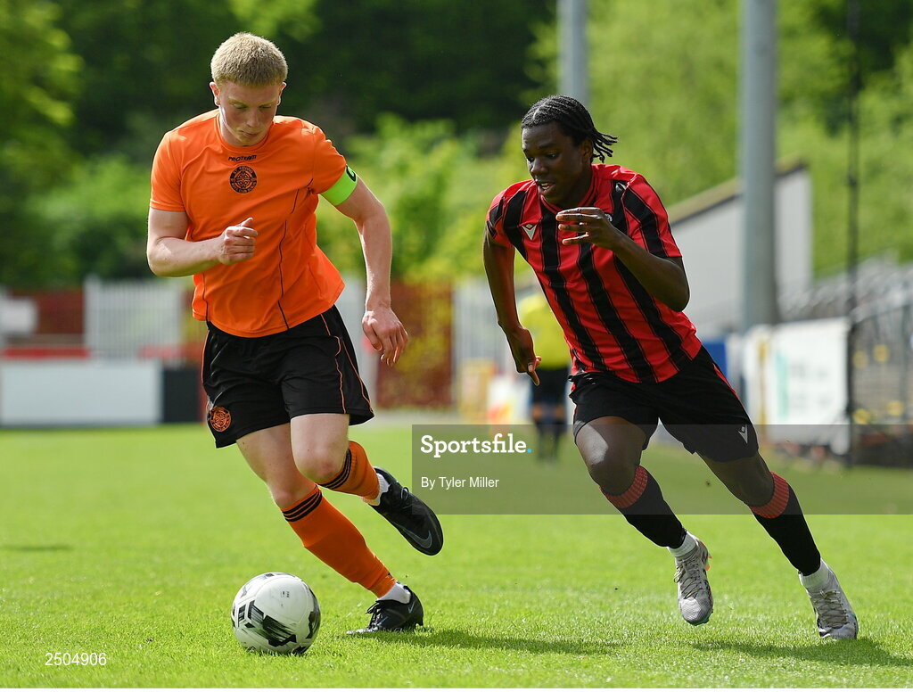 6 May 2023; Emmanual Ayoola of Cherry Orchard FC in action against Logan O'Connell of St Kevin's FC during the FAI Under 17 Cup Final 2022/23 match between Cherry Orchard FC and St Kevin’s Boys FC at Richmond Park in Dublin. Photo by Tyler Miller/Sportsfile