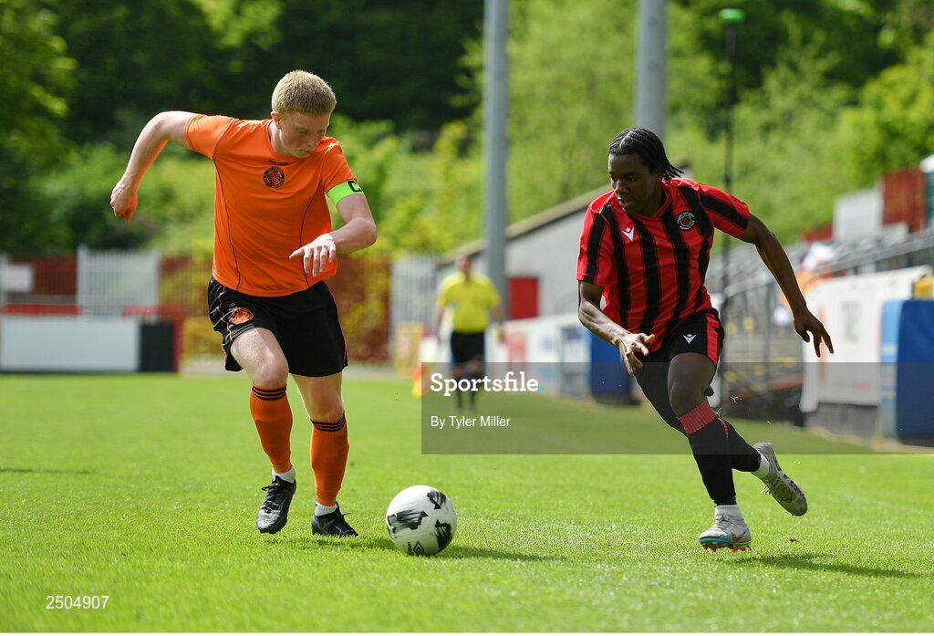 6 May 2023; Emmanual Ayoola of Cherry Orchard FC in action against Logan O'Connell of St Kevin's FC during the FAI Under 17 Cup Final 2022/23 match between Cherry Orchard FC and St Kevin’s Boys FC at Richmond Park in Dublin. Photo by Tyler Miller/Sportsfile