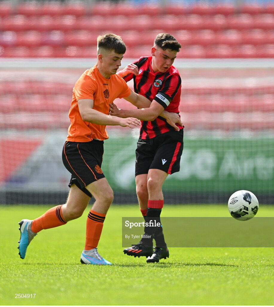 6 May 2023; Luke O'Connor of St Kevin's FC in action against Dane Mahon of Cherry Orchard FC during the FAI Under 17 Cup Final 2022/23 match between Cherry Orchard FC and St Kevin’s Boys FC at Richmond Park in Dublin. Photo by Tyler Miller/Sportsfile
