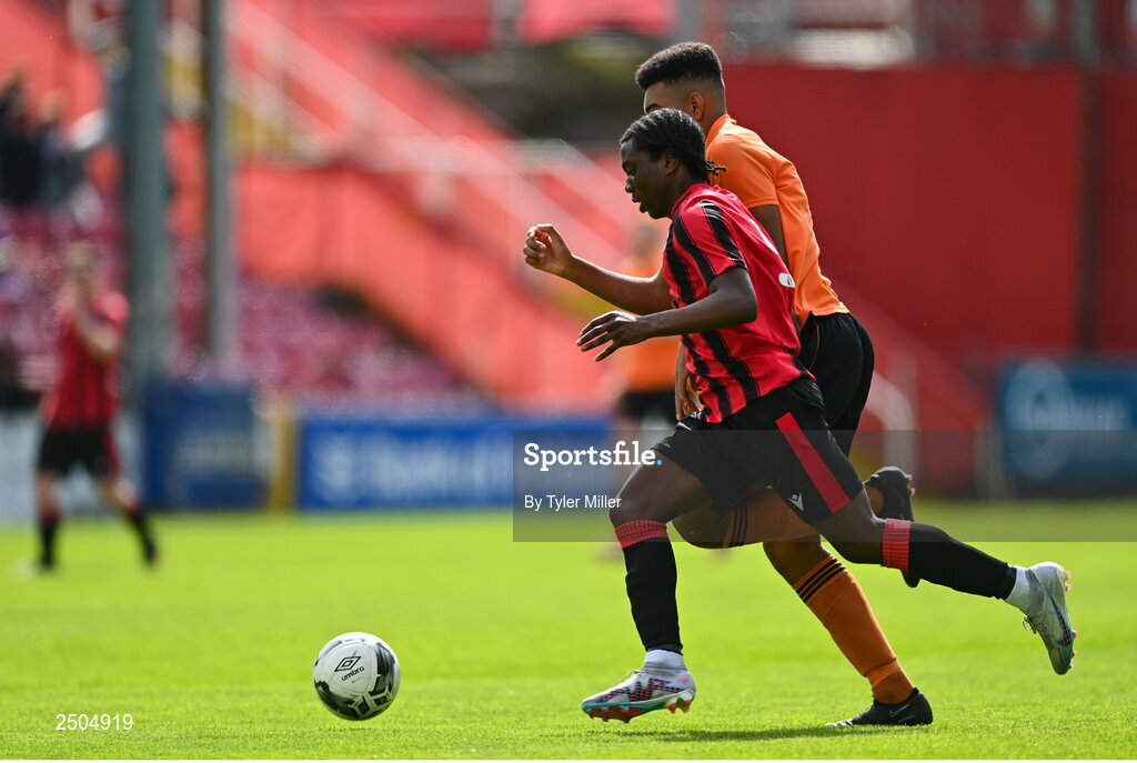 6 May 2023; Emmanual Ayoola of Cherry Orchard FC in action against Jack Allen of St Kevin's FC during the FAI Under 17 Cup Final 2022/23 match between Cherry Orchard FC and St Kevin’s Boys FC at Richmond Park in Dublin. Photo by Tyler Miller/Sportsfile