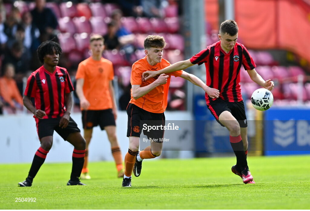 6 May 2023; Harry Philips of Cherry Orchard FC in action against Sam Dunne of St Kevin's FC during the FAI Under 17 Cup Final 2022/23 match between Cherry Orchard FC and St Kevin’s Boys FC at Richmond Park in Dublin. Photo by Tyler Miller/Sportsfile