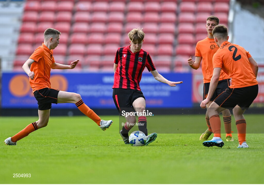 6 May 2023; Adam Byrne of Cherry Orchard FC in action against Evan McGee of St Kevin's FC, left, and Luke O'Connor during the FAI Under 17 Cup Final 2022/23 match between Cherry Orchard FC and St Kevin’s Boys FC at Richmond Park in Dublin. Photo by Tyler Miller/Sportsfile