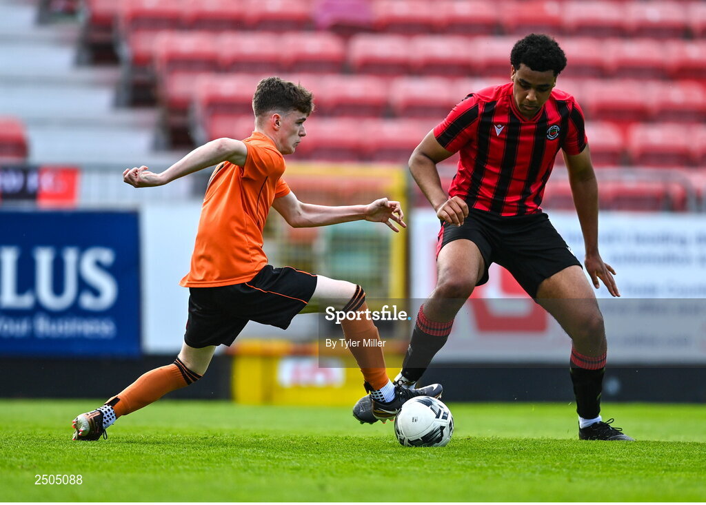 6 May 2023; Sam Dunne of St Kevin's FC in action against Josh Okagbue of Cherry Orchard FC during the FAI Under 17 Cup Final 2022/23 match between Cherry Orchard FC and St Kevin’s Boys FC at Richmond Park in Dublin. Photo by Tyler Miller/Sportsfile