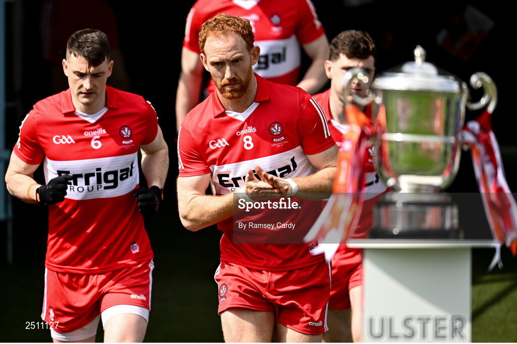 14 May 2023; Derry captain Conor Glass runs past the Anglo Celt Cup before the Ulster GAA Football Senior Championship Final match between Armagh and Derry at St Tiernach’s Park in Clones, Monaghan. Photo by Ramsey Cardy/Sportsfile