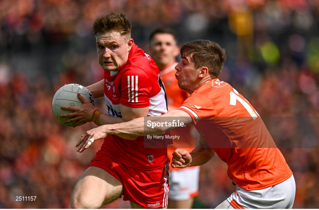 14 May 2023; Ethan Doherty of Derry is tackled by Andrew Murnin of Armagh during the Ulster GAA Football Senior Championship Final match between Armagh and Derry at St Tiernach’s Park in Clones, Monaghan. Photo by Harry Murphy/Sportsfile