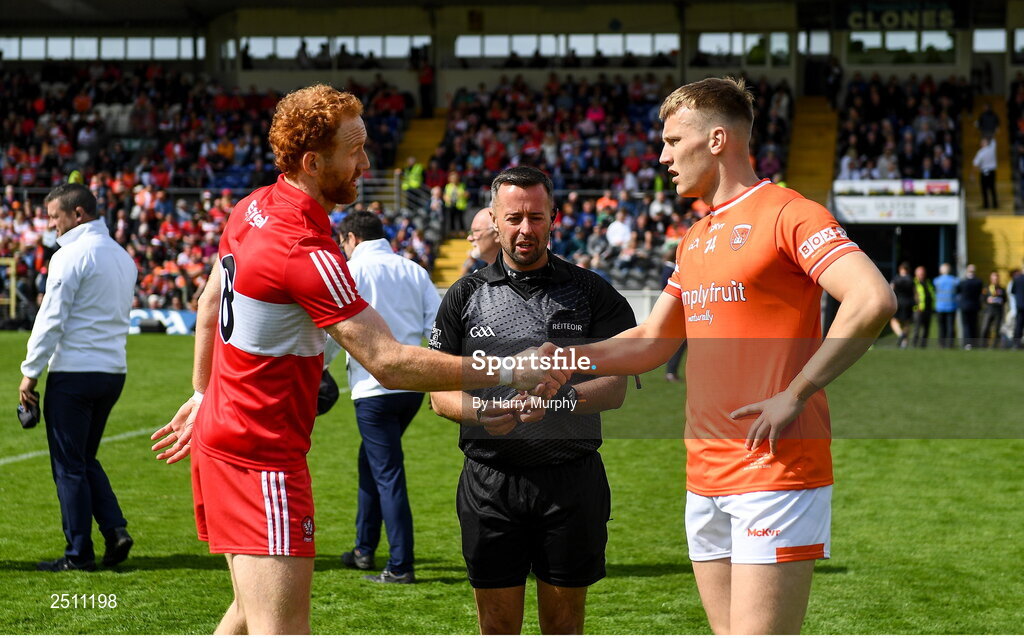 14 May 2023; Derry captain Conor Glass and Armagh captain Rian O'Neill with referee David Gough before the Ulster GAA Football Senior Championship Final match between Armagh and Derry at St Tiernach’s Park in Clones, Monaghan. Photo by Harry Murphy/Sportsfile