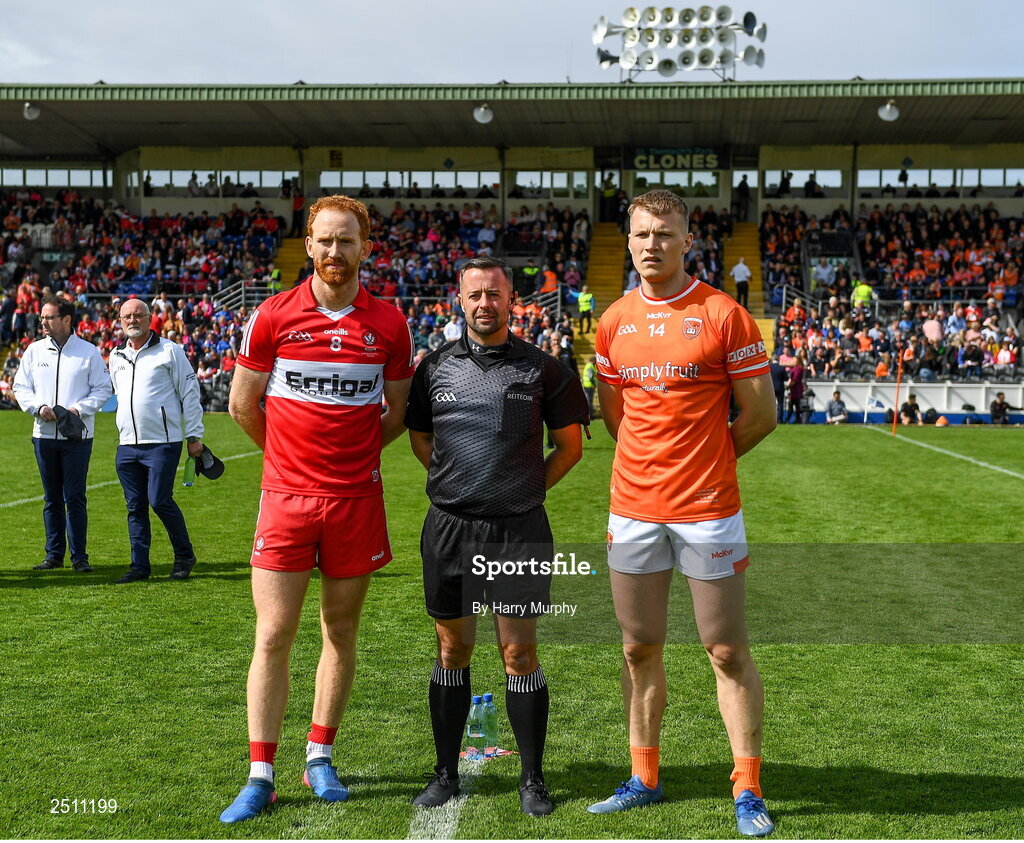 14 May 2023; Derry captain Conor Glass and Armagh captain Rian O'Neill with referee David Gough before the Ulster GAA Football Senior Championship Final match between Armagh and Derry at St Tiernach’s Park in Clones, Monaghan. Photo by Harry Murphy/Sportsfile