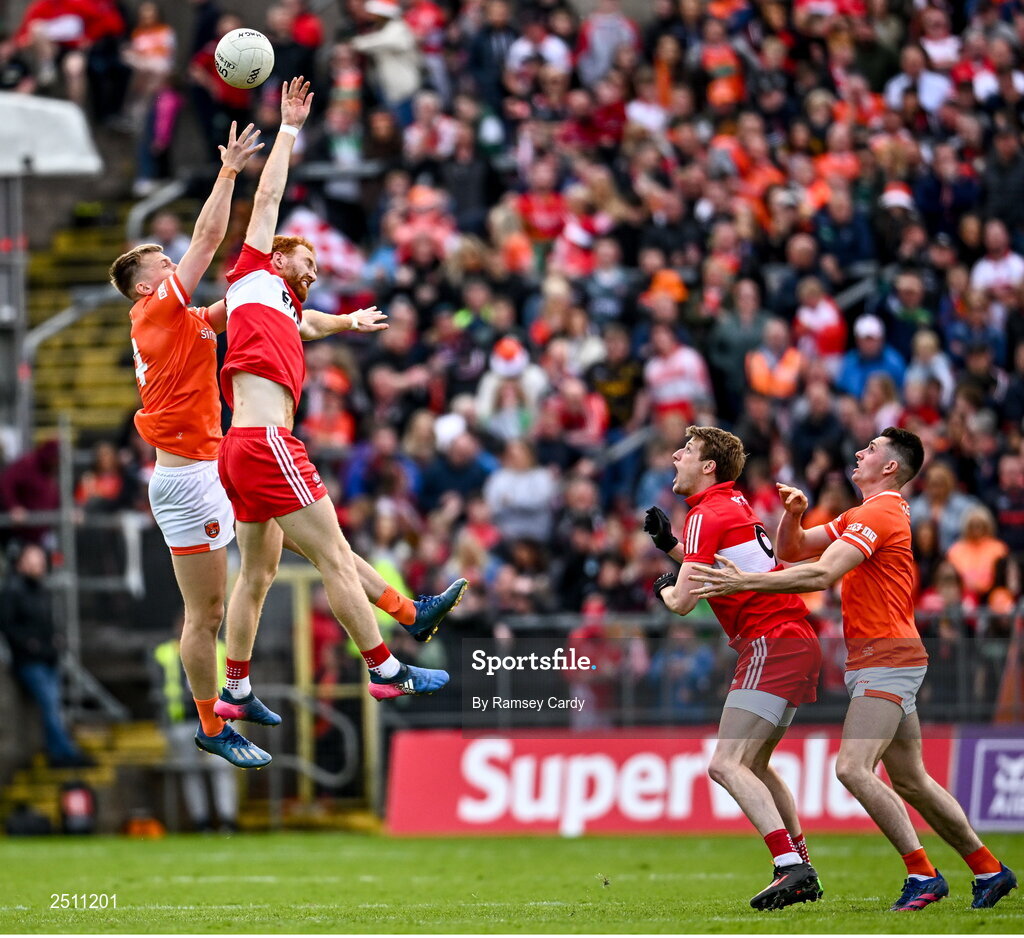14 May 2023; Conor Glass of Derry and Rian O'Neill of Armagh compete for the second half throw-in during the Ulster GAA Football Senior Championship Final match between Armagh and Derry at St Tiernach’s Park in Clones, Monaghan. Photo by Ramsey Cardy/Sportsfile