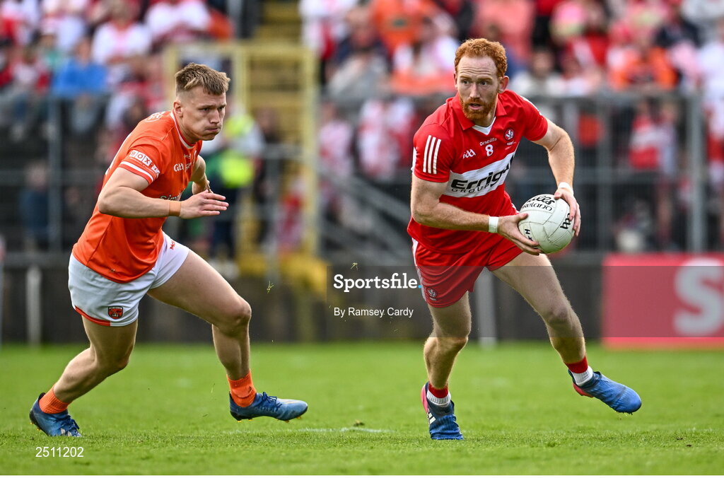 14 May 2023; Conor Glass of Derry in action against Rian O'Neill of Armagh during the Ulster GAA Football Senior Championship Final match between Armagh and Derry at St Tiernach’s Park in Clones, Monaghan. Photo by Ramsey Cardy/Sportsfile