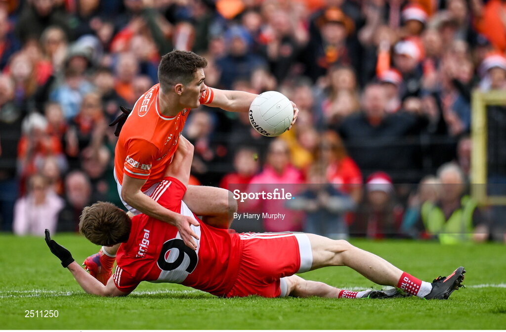 14 May 2023; Jarly Óg Burns of Armagh is fouled by Brendan Rogers of Derry during the Ulster GAA Football Senior Championship Final match between Armagh and Derry at St Tiernach’s Park in Clones, Monaghan. Photo by Harry Murphy/Sportsfile