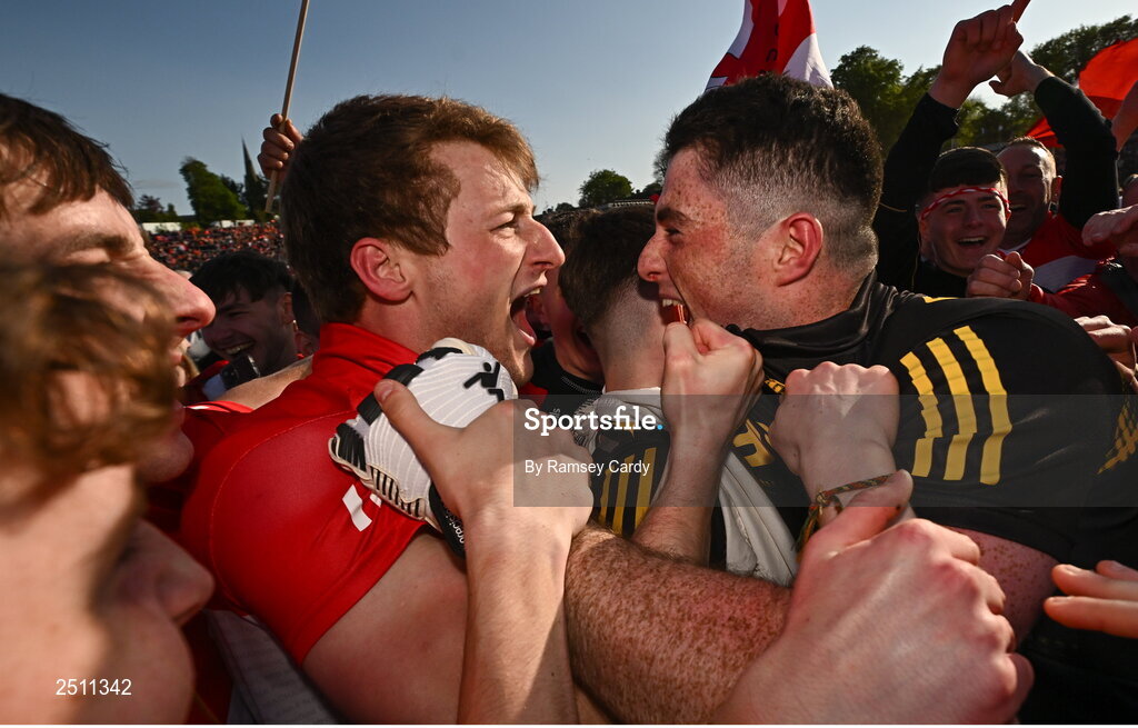 14 May 2023; Derry players Brendan Rogers, left, and goalkeeper Odhran Lynch celebrate after their victory in the Ulster GAA Football Senior Championship Final match between Armagh and Derry at St Tiernach’s Park in Clones, Monaghan. Photo by Ramsey Cardy/Sportsfile