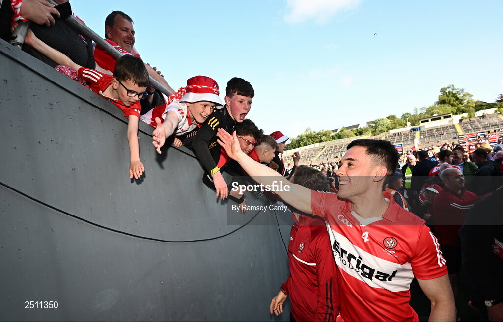 14 May 2023; Conor McCluskey of Derry celebrates with supporters after the Ulster GAA Football Senior Championship Final match between Armagh and Derry at St Tiernach’s Park in Clones, Monaghan. Photo by Ramsey Cardy/Sportsfile