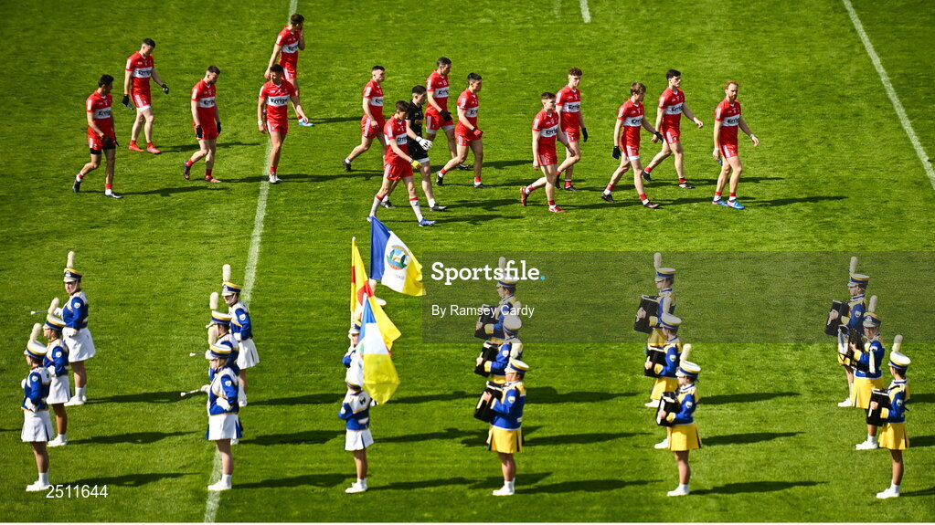 14 May 2023; The Derry team join the Mayobridge band for the parade before the Ulster GAA Football Senior Championship Final match between Armagh and Derry at St Tiernach’s Park in Clones, Monaghan. Photo by Ramsey Cardy/Sportsfile