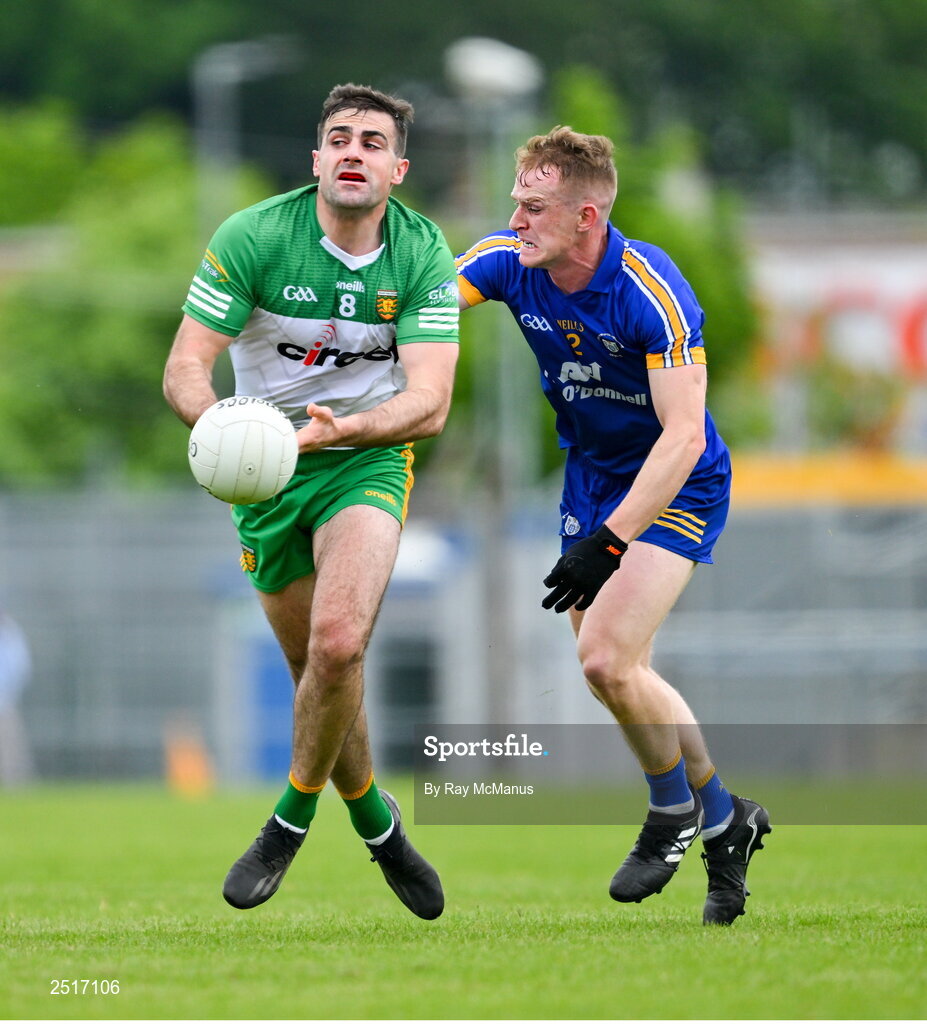 20 May 2023; Caolan McGonagle of Donegal is tackled by Pearse Lillis of Clare during the GAA Football All-Ireland Senior Championship Round 1 match between Clare and Donegal at Cusack Park in Ennis, Clare. Photo by Ray McManus/Sportsfile