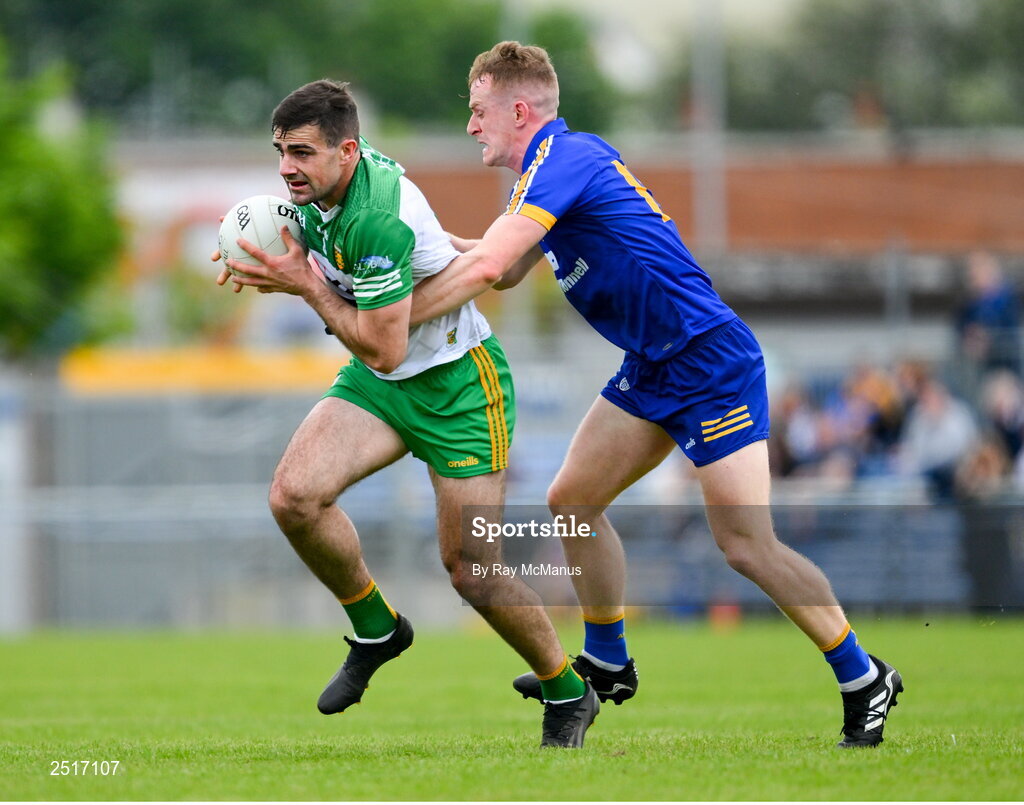 20 May 2023; Caolan McGonagle of Donegal is tackled by Pearse Lillis of Clare during the GAA Football All-Ireland Senior Championship Round 1 match between Clare and Donegal at Cusack Park in Ennis, Clare. Photo by Ray McManus/Sportsfile