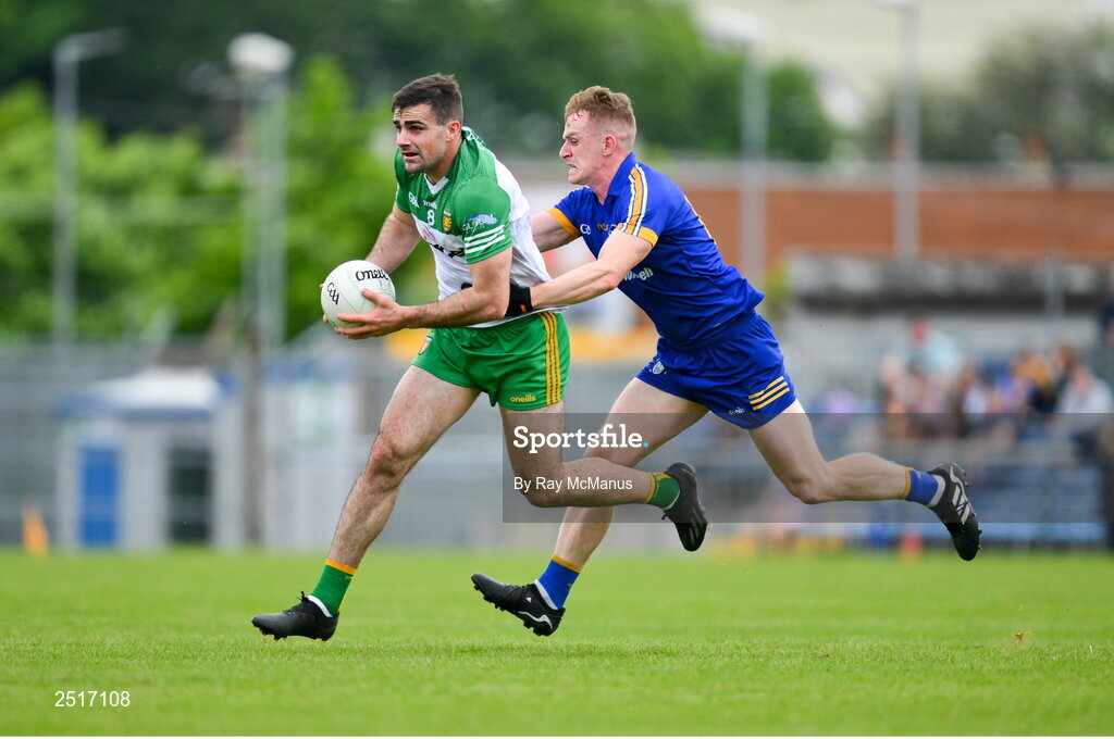 20 May 2023; Caolan McGonagle of Donegal is tackled by Pearse Lillis of Clare during the GAA Football All-Ireland Senior Championship Round 1 match between Clare and Donegal at Cusack Park in Ennis, Clare. Photo by Ray McManus/Sportsfile