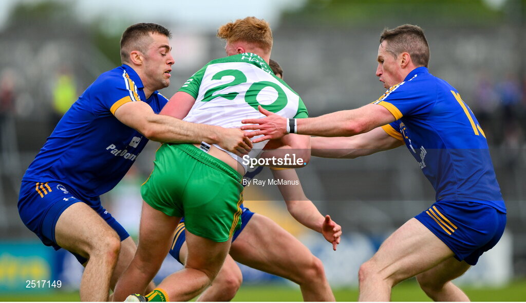20 May 2023; Oisin Gallen of Donegal is tackled by Clare players, Cillian Brennan, left, Eoin Cleary, right and Emmet McMahon during the GAA Football All-Ireland Senior Championship Round 1 match between Clare and Donegal at Cusack Park in Ennis, Clare. Photo by Ray McManus/Sportsfile