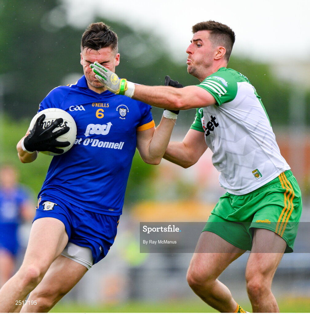 20 May 2023; Jamie Malone of Clare is tackled by Daire Ó Baoill of Donegal during the GAA Football All-Ireland Senior Championship Round 1 match between Clare and Donegal at Cusack Park in Ennis, Clare. Photo by Ray McManus/Sportsfile