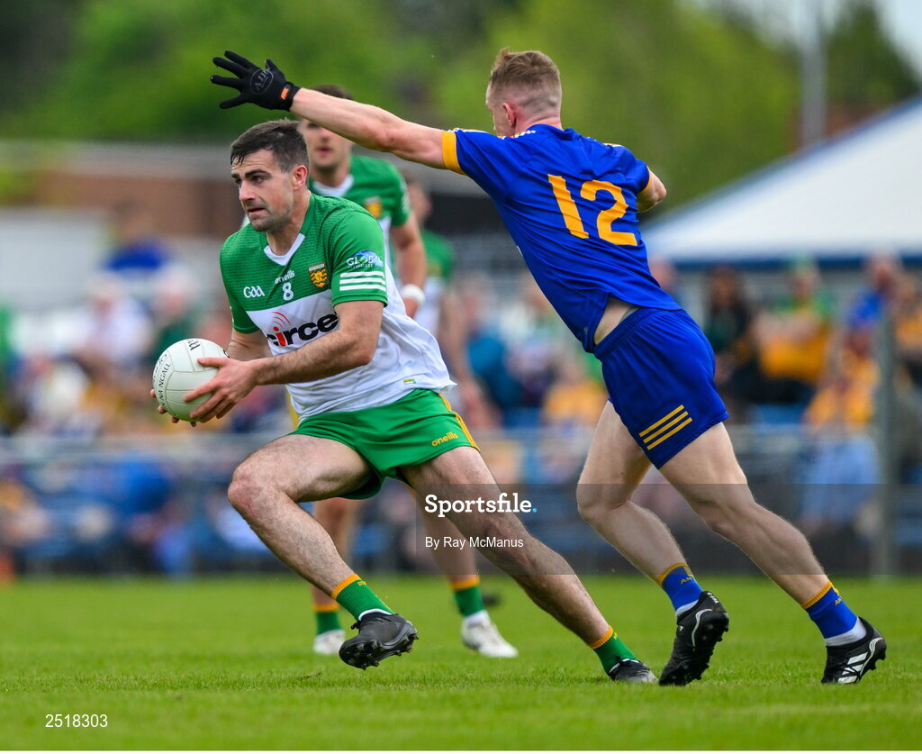 20 May 2023; Caolan McGonagle of Donegal in action against Pearse Lillis of Clare during the GAA Football All-Ireland Senior Championship Round 1 match between Clare and Donegal at Cusack Park in Ennis, Clare. Photo by Ray McManus/Sportsfile