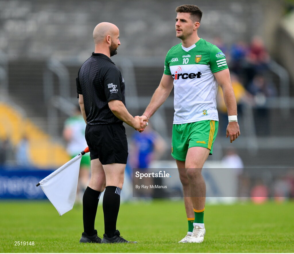 20 May 2023; Daire Ó Baoill of Donegal shakes hands with linesman Brendan Crawley before the GAA Football All-Ireland Senior Championship Round 1 match between Clare and Donegal at Cusack Park in Ennis, Clare. Photo by Ray McManus/Sportsfile