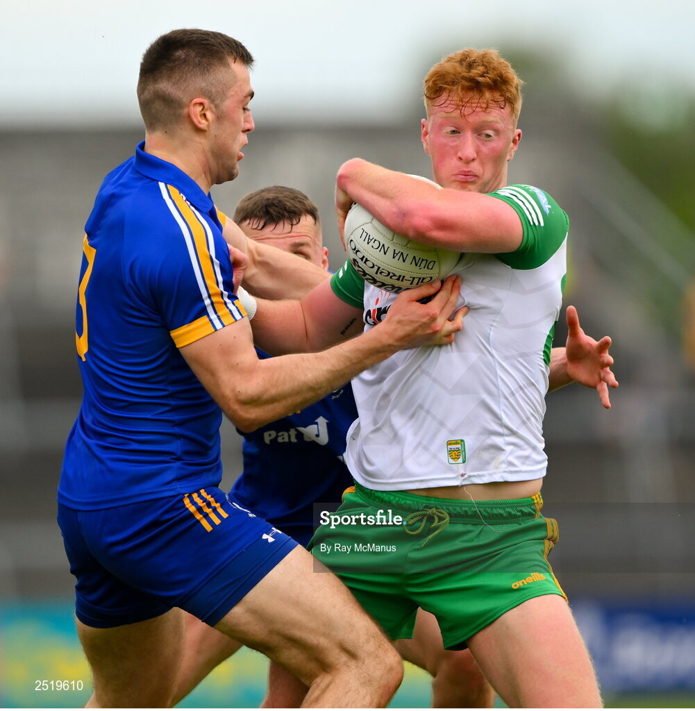 20 May 2023; Oisin Gallen of Donegal is tackled by Cillian Brennan, 3, and Emmet McMahon of Clare during the GAA Football All-Ireland Senior Championship Round 1 match between Clare and Donegal at Cusack Park in Ennis, Clare. Photo by Ray McManus/Sportsfile