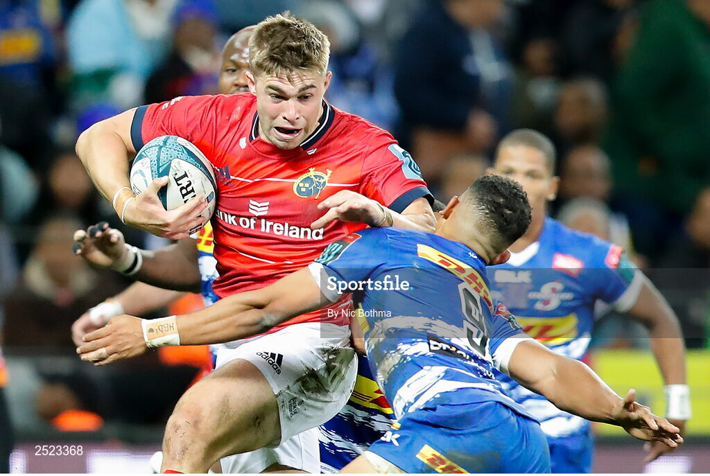 27 May 2023; Jack Crowley of Munster is tackled by Herschel Jantjies of DHL Stormers during the United Rugby Championship Final match between DHL Stormers and Munster at DHL Stadium in Cape Town, South Africa. Photo by Nic Bothma/Sportsfile