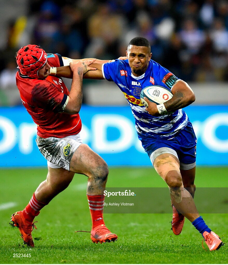 27 May 2023; Leolin Zas of DHL Stormers is tackled by John Hodnett of Munster  during the United Rugby Championship Final match between DHL Stormers and Munster at DHL Stadium in Cape Town, South Africa. Photo by Ashley Vlotman/Sportsfile