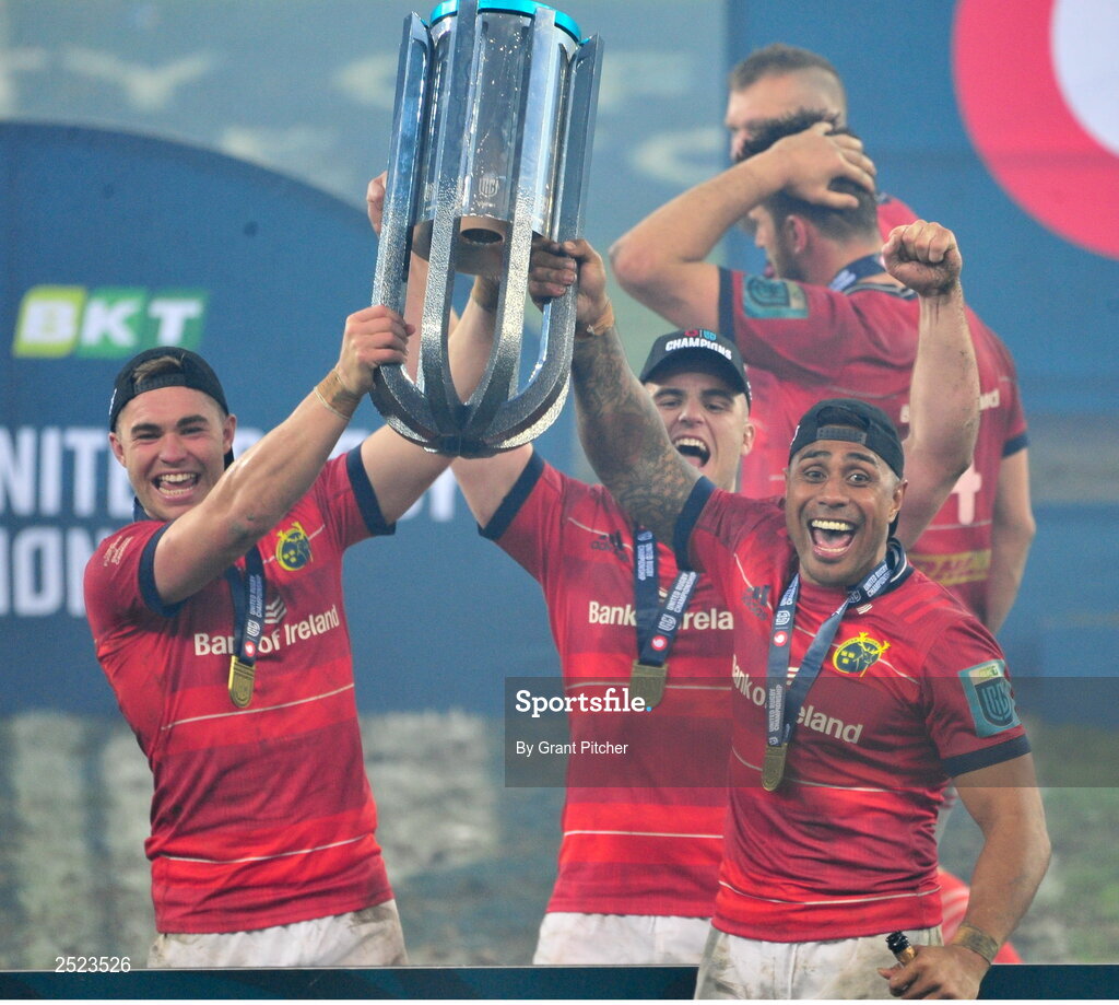 27 May 2023; Munster players, from left, Jack Crowley, Alen Kendellen and Malakai Fekitoa celebrate with the trophy after the United Rugby Championship Final match between DHL Stormers and Munster at DHL Stadium in Cape Town, South Africa. Photo by Grant Pitcher/Sportsfile