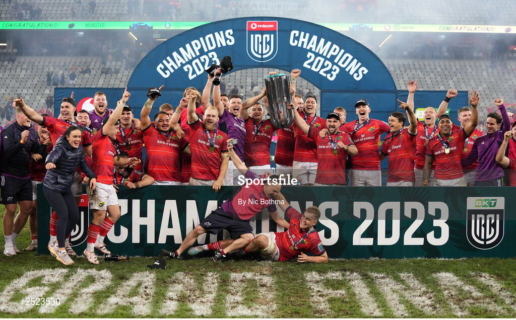 27 May 2023; Munster players celebrate with the trophy after victory in the United Rugby Championship Final match between DHL Stormers and Munster at DHL Stadium in Cape Town, South Africa. Photo by Nic Bothma/Sportsfile