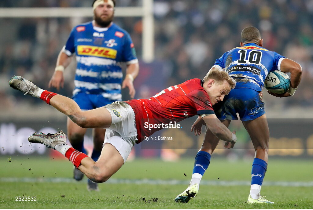 27 May 2023; Manie Libbok of DHL Stormers is tackled by Mike Haley of Munster during the United Rugby Championship Final match between DHL Stormers and Munster at DHL Stadium in Cape Town, South Africa. Photo by Nic Bothma/Sportsfile