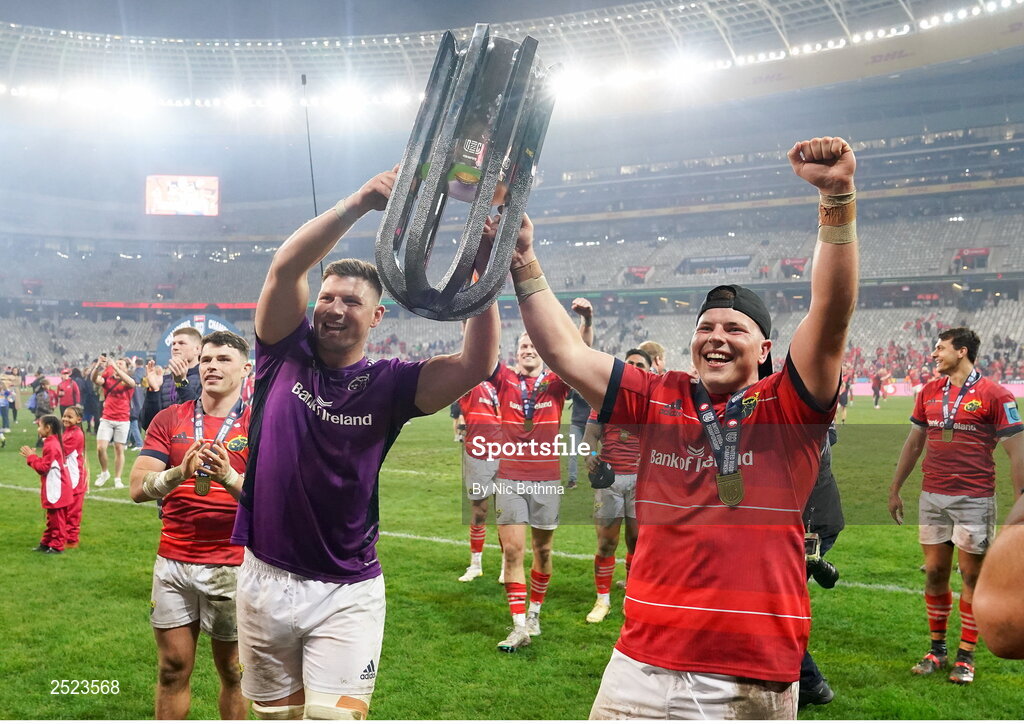 27 May 2023; Munster players and brothers Fineen Wycherley, left, and Josh Wycherley celebrate with the trophy after winning the United Rugby Championship Final match between DHL Stormers and Munster at DHL Stadium in Cape Town, South Africa. Photo by Nic Bothma/Sportsfile
