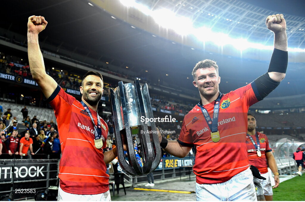27 May 2023; Munster players Conor Murray, left, and captain Peter O'Mahony celebrate with the trophy after the United Rugby Championship Final match between DHL Stormers and Munster at DHL Stadium in Cape Town, South Africa. Photo by Ashley Vlotman/Sportsfile