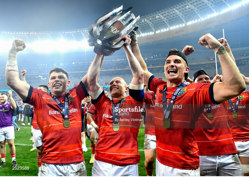 27 May 2023; Munster players, from left, Calvin Nash, Keith Earls and Shane Daly celebrate with the trophy after the United Rugby Championship Final match between DHL Stormers and Munster at DHL Stadium in Cape Town, South Africa. Photo by Ashley Vlotman/Sportsfile