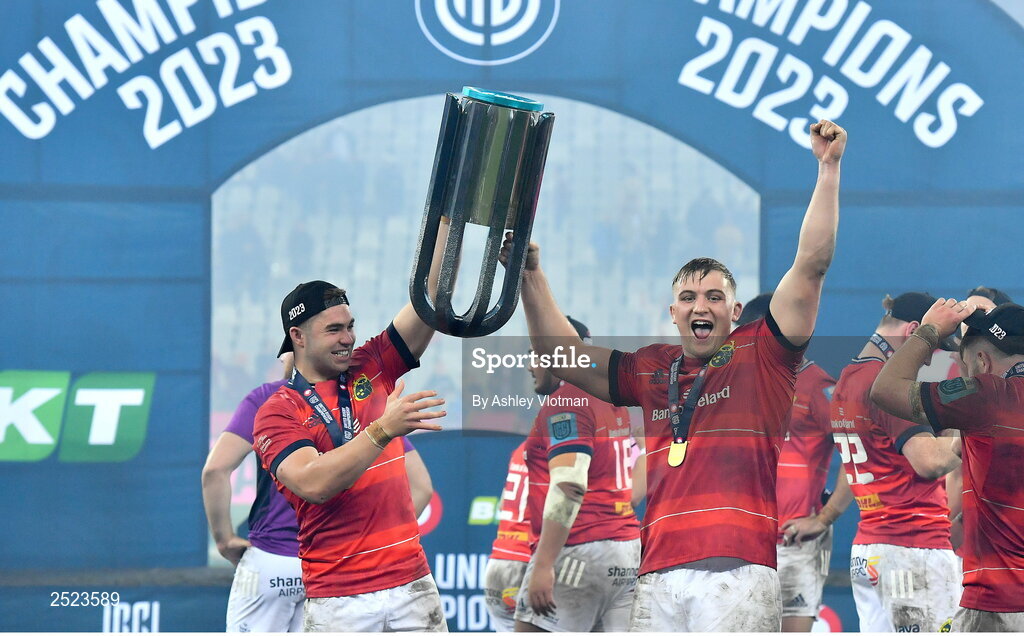 27 May 2023; Munster players Jack Crowley, left, and Gavin Coombes celebrate with the trophy after the United Rugby Championship Final match between DHL Stormers and Munster at DHL Stadium in Cape Town, South Africa. Photo by Ashley Vlotman/Sportsfile