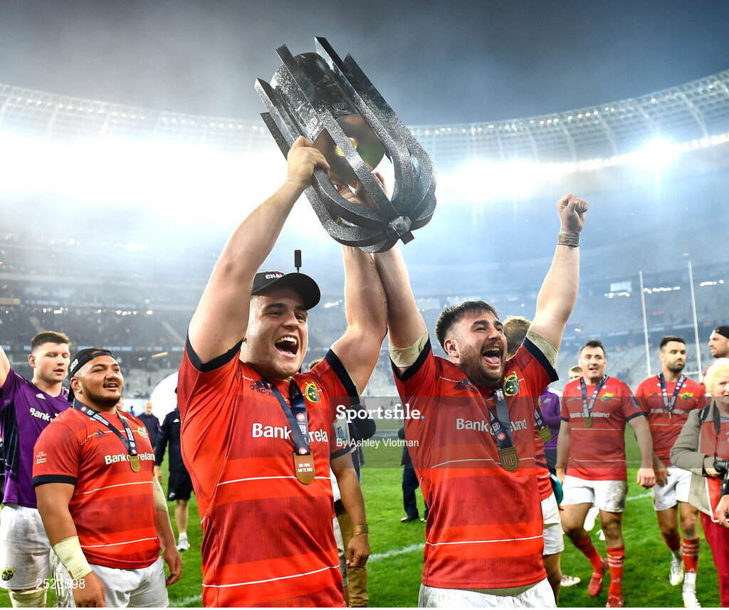 27 May 2023; Munster players Alex Kendellen, left, and John Hodnett celebrate with the trophy after the United Rugby Championship Final match between DHL Stormers and Munster at DHL Stadium in Cape Town, South Africa. Photo by Ashley Vlotman/Sportsfile