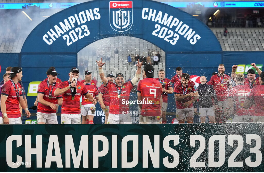 27 May 2023; Munster playrs celebrate on the podium after winning the United Rugby Championship Final match between DHL Stormers and Munster at DHL Stadium in Cape Town, South Africa. Photo by Nic Bothma/Sportsfile