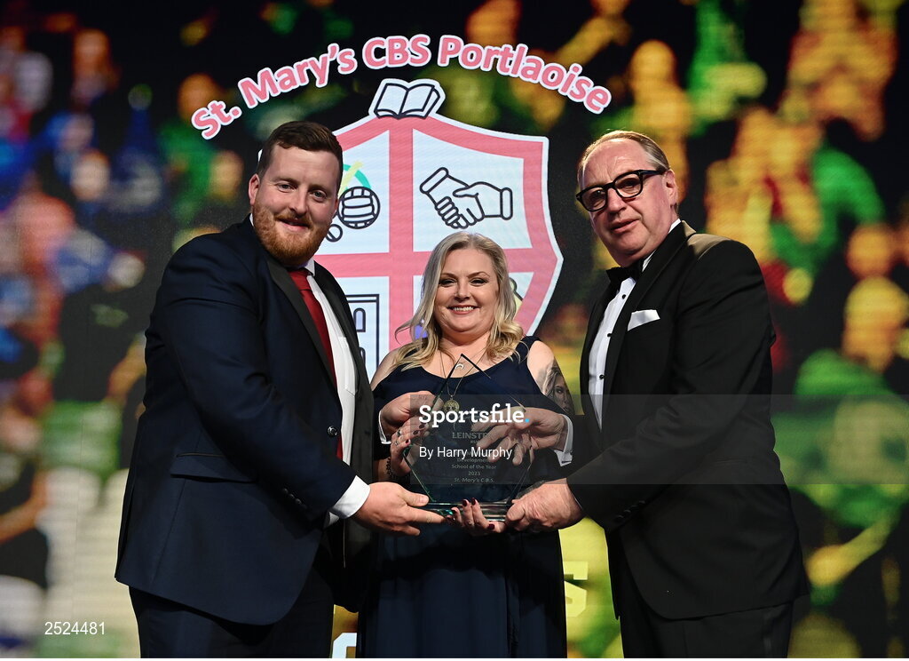 28 May 2023; Conor Ryan of St Mary's CBS, Portlaoise, is presented the Best Menswear Development School of the Year award by John Smith of Best Menswear and Leinster Rugby president Debbie Carty. The Leinster Rugby Awards Ball, which took place at The Clayton Hotel Burlington Road in Dublin, was a celebration of the 2022/23 Leinster Rugby. Photo by Harry Murphy/Sportsfile