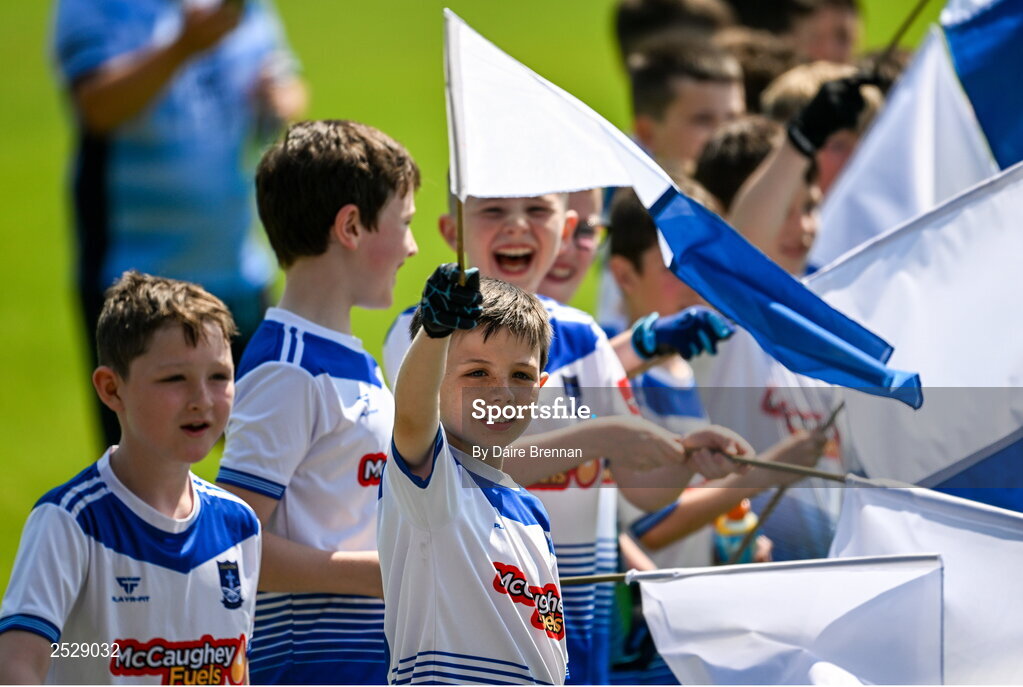 4 June 2023; Jack Horkan, aged 9, from Clones, Monaghan along with his Clones GAA U11 team-mates greet the Monaghan team as they enter the pitch ahead of the GAA Football All-Ireland Senior Championship Round 2 match between Monaghan and Clare at St Tiernach's Park in Clones, Monaghan. Photo by Daire Brennan/Sportsfile