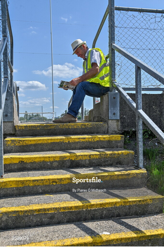 4 June 2023; Steward Junior Caslin, from Kilmore, reads the programme before the GAA Football All-Ireland Senior Championship Round 2 match between Roscommon and Sligo at Dr Hyde Park in Roscommon. Photo by Piaras Ó Mídheach/Sportsfile
