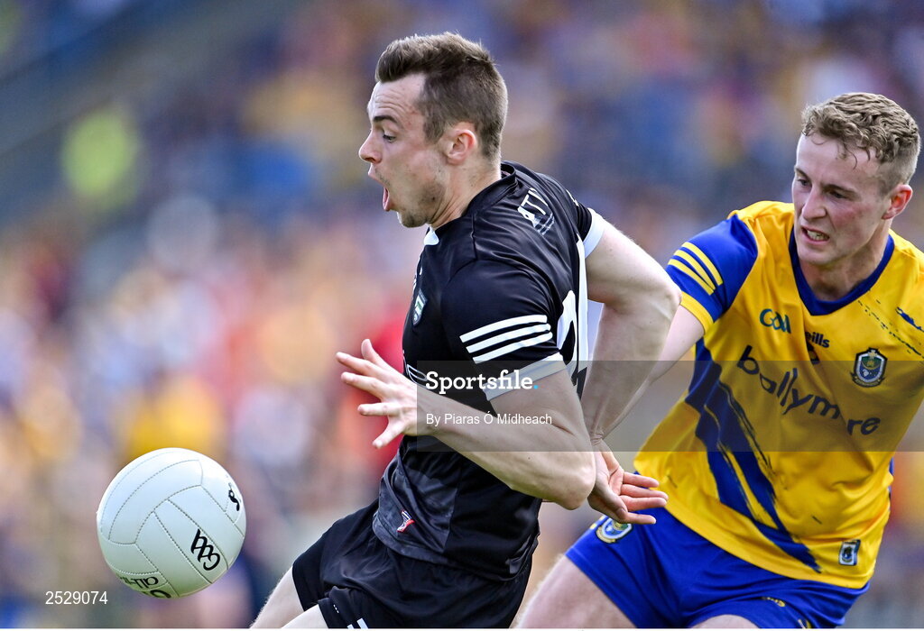 4 June 2023; Luke Nicholson of Sligo in action against Eoin McCormack of Roscommon during the GAA Football All-Ireland Senior Championship Round 2 match between Roscommon and Sligo at Dr Hyde Park in Roscommon. Photo by Piaras Ó Mídheach/Sportsfile