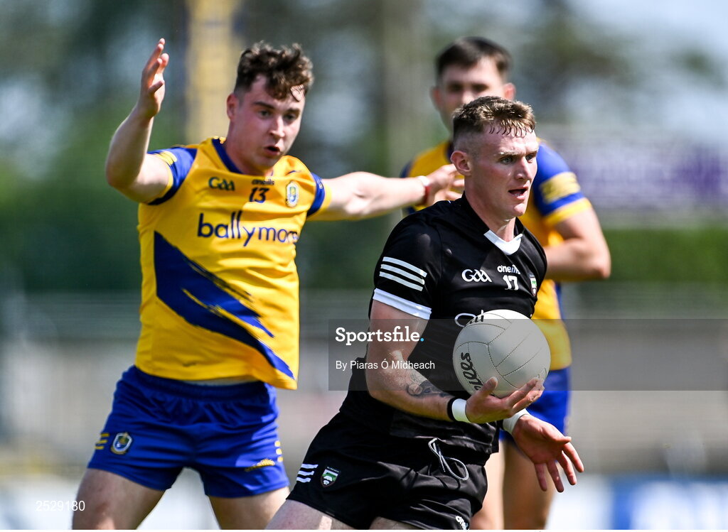 4 June 2023; Alan Reilly of Sligo in action against Cian McKeon of Roscommon during the GAA Football All-Ireland Senior Championship Round 2 match between Roscommon and Sligo at Dr Hyde Park in Roscommon. Photo by Piaras Ó Mídheach/Sportsfile