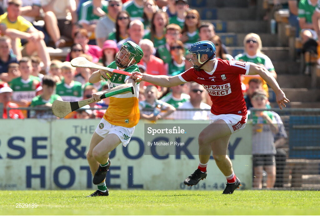 4 June 2023; Adam Screeney of Offaly in action against Darragh O'Sullivan of Cork during the O’Neills.com GAA Hurling All-Ireland U20 Championship Final match between Cork and Offaly at FBD Semple Stadium in Thurles, Tipperary. Photo by Michael P Ryan/Sportsfile