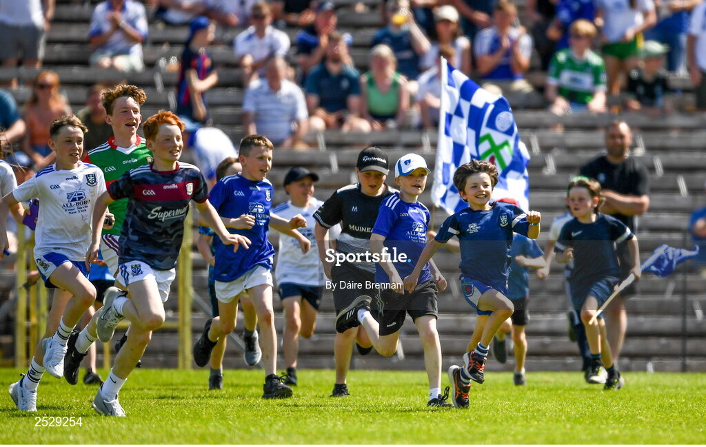 4 June 2023; Young supporters race onto the field at the full time whistle after the GAA Football All-Ireland Senior Championship Round 2 match between Monaghan and Clare at St Tiernach's Park in Clones, Monaghan. Photo by Daire Brennan/Sportsfile
