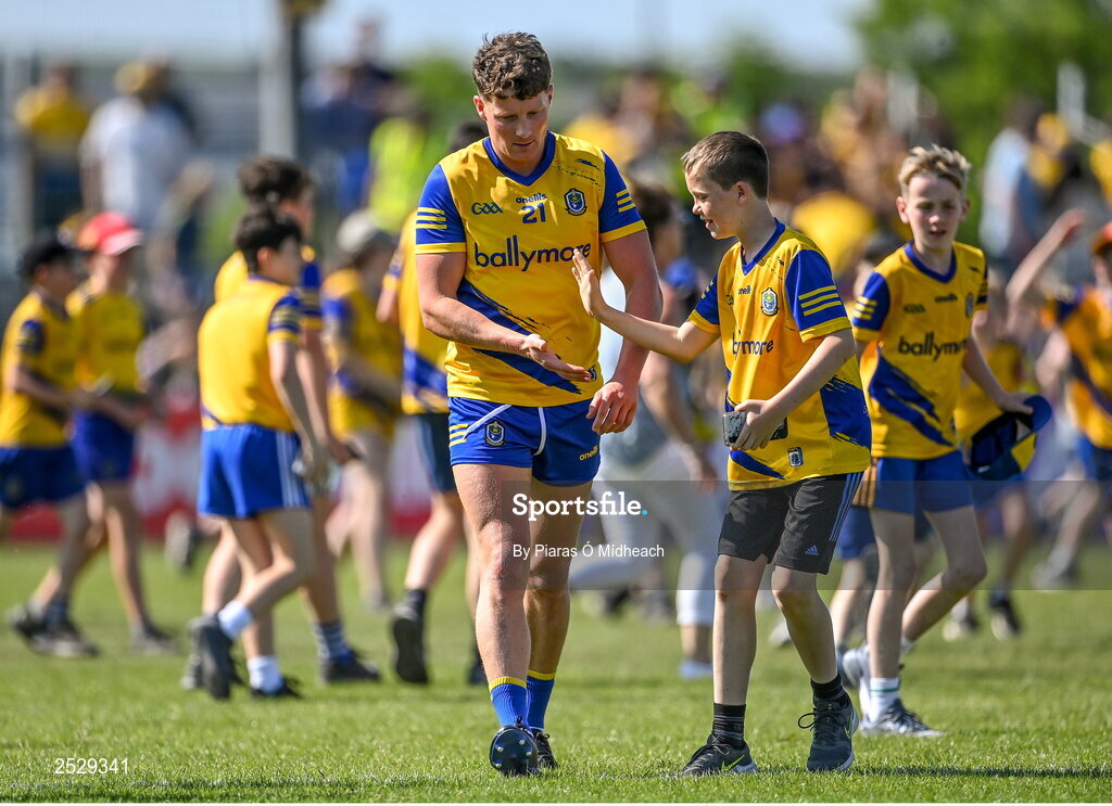 4 June 2023; Conor Cox of Roscommon celebrates with a supporter after his side's victory in the GAA Football All-Ireland Senior Championship Round 2 match between Roscommon and Sligo at Dr Hyde Park in Roscommon. Photo by Piaras Ó Mídheach/Sportsfile