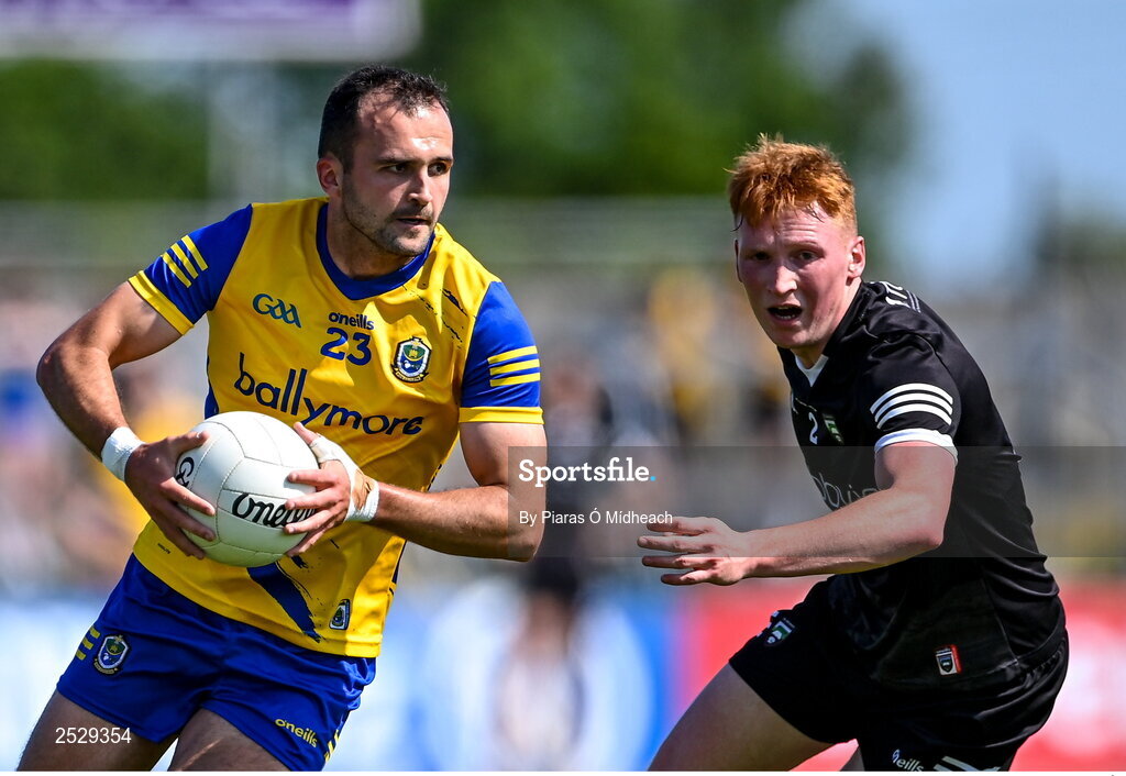 4 June 2023; Donie Smith of Roscommon in action against Evan Lyons of Sligo during the GAA Football All-Ireland Senior Championship Round 2 match between Roscommon and Sligo at Dr Hyde Park in Roscommon. Photo by Piaras Ó Mídheach/Sportsfile