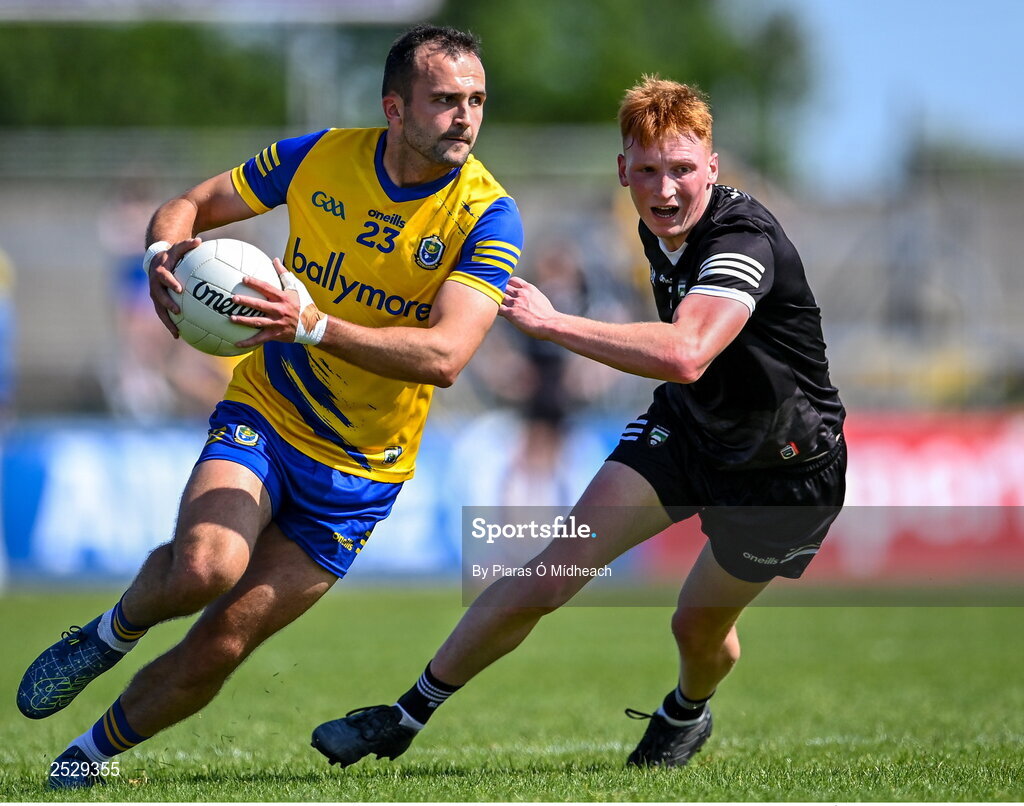 4 June 2023; Donie Smith of Roscommon in action against Evan Lyons of Sligo during the GAA Football All-Ireland Senior Championship Round 2 match between Roscommon and Sligo at Dr Hyde Park in Roscommon. Photo by Piaras Ó Mídheach/Sportsfile